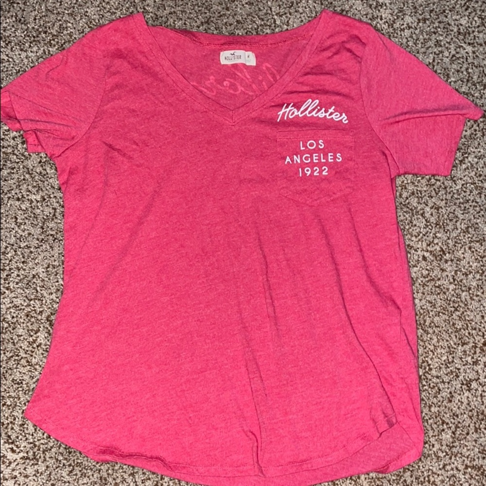 A hot pink Hollister Tee Shirt.